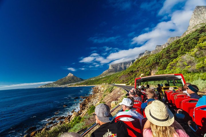 Experience Cape Town's stunning coastline as you ride the open-top bus soaking in breathtaking views of Table Mountain and the sparkling ocean creating unforgettable travel memories.